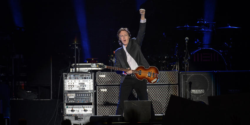 Paul McCartney, plays guitar during his first ever concert at the Bryce Jordan Center in 2015.