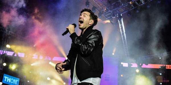 Surprise performance by Andy Grammer on Friday night of THON.  Closeup of Andy singing on stage.