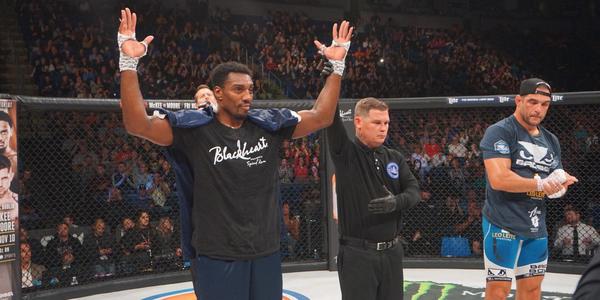 Phil Davis arms raised celebrating his Bellator MMA win in 2017