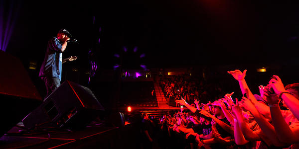 Kendrick Lamar raps on stage for the crowd at the Bryce Jordan Center in 2013.