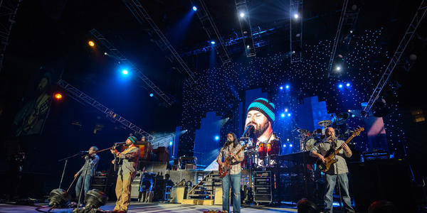 Zac Brown Band performs on stage for the audience at the Bryce Jordan Center in 2012.