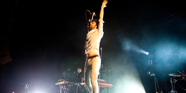 Michael Angelakos, lead vocalist of Passion Pit, points his mic to the crowd as they scream his lyrics at the BJC in 2010.