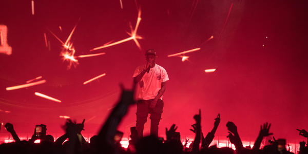Travis Scott performs on stage for a large crowd at Bryce Jordan Center 