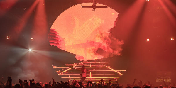 Travis Scott performs on stage for a large crowd at Bryce Jordan Center 