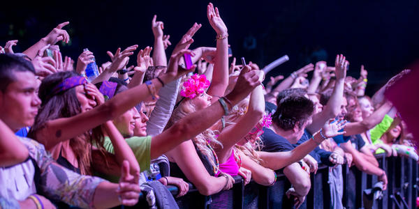 Fans dance and smile during DJ Bassnector's performance at the Bryce Jordan Center.