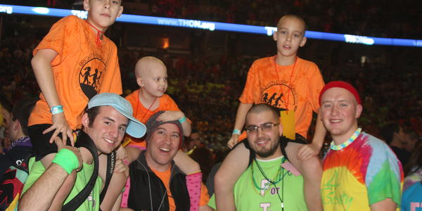 THON members carrying THON children on their shoulders.