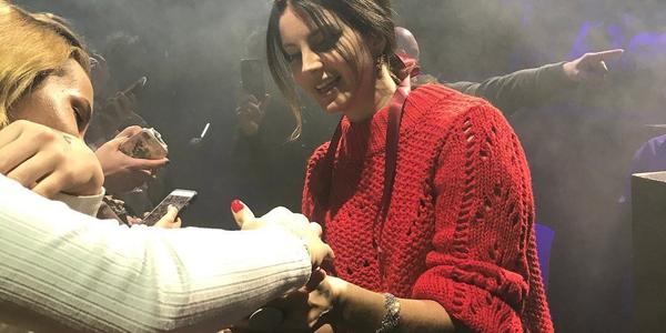 Lana Del Rey interacts with fans and signing autographs