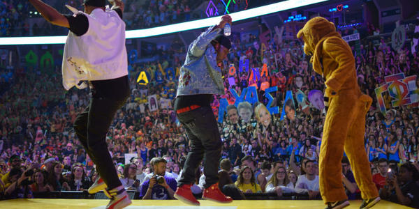 Nittany Lion and friends dancing on stage