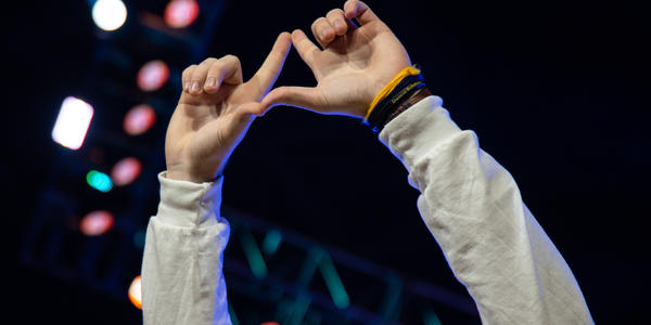 Dancer hands making the THON diamond